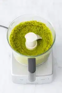 Coarsely ground pistachios in food processor for pistachio butter recipe