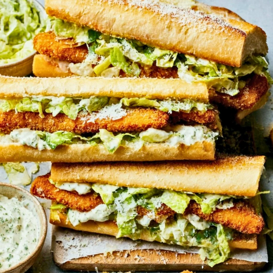 Chicken Caesar Sandwich with crispy chicken, lettuce, and Parmesan cheese on bread