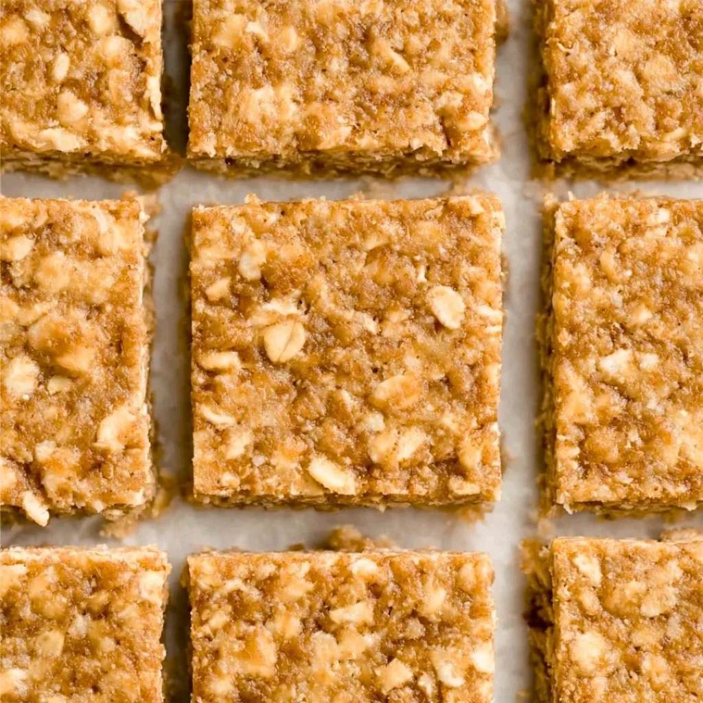 A bright, fizzy blue beverage with granulated salt crystals and a clear jar on a granite surface.