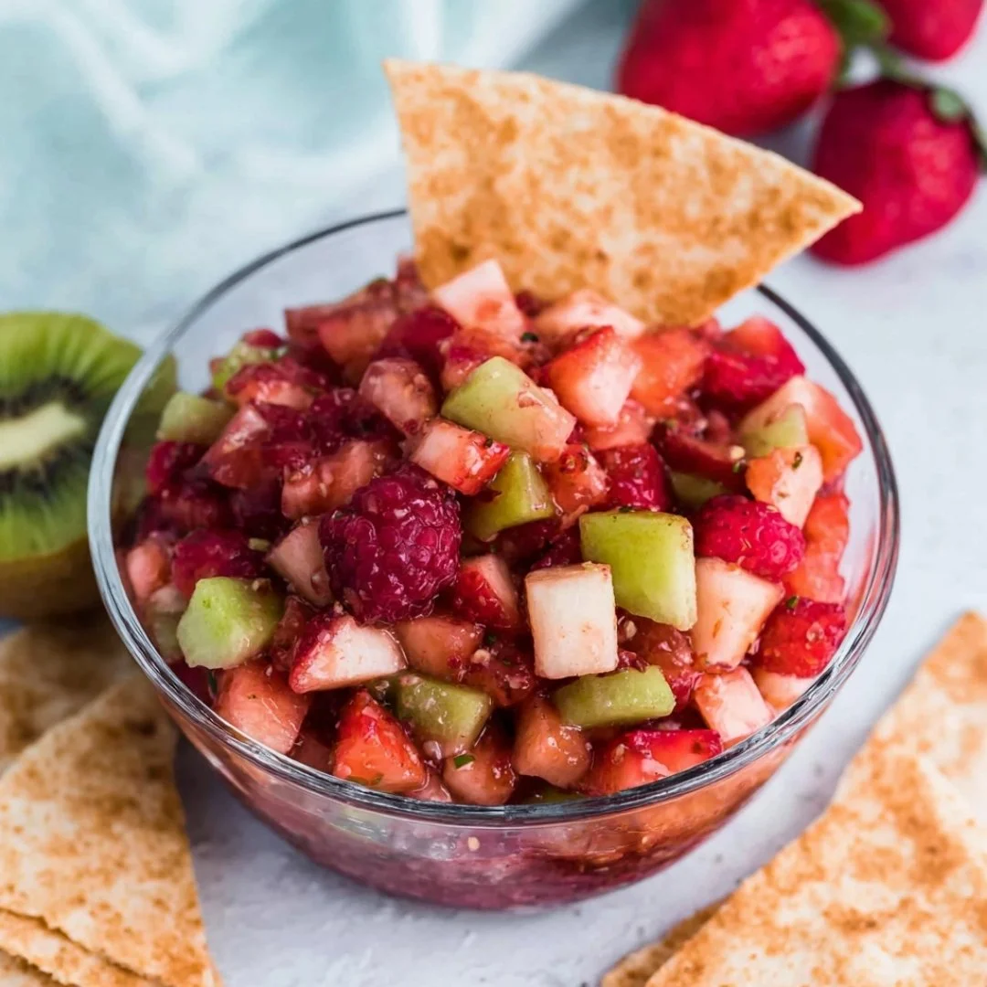 Bowl of sweet fruit salsa with cinnamon tortilla chips for a delicious snack